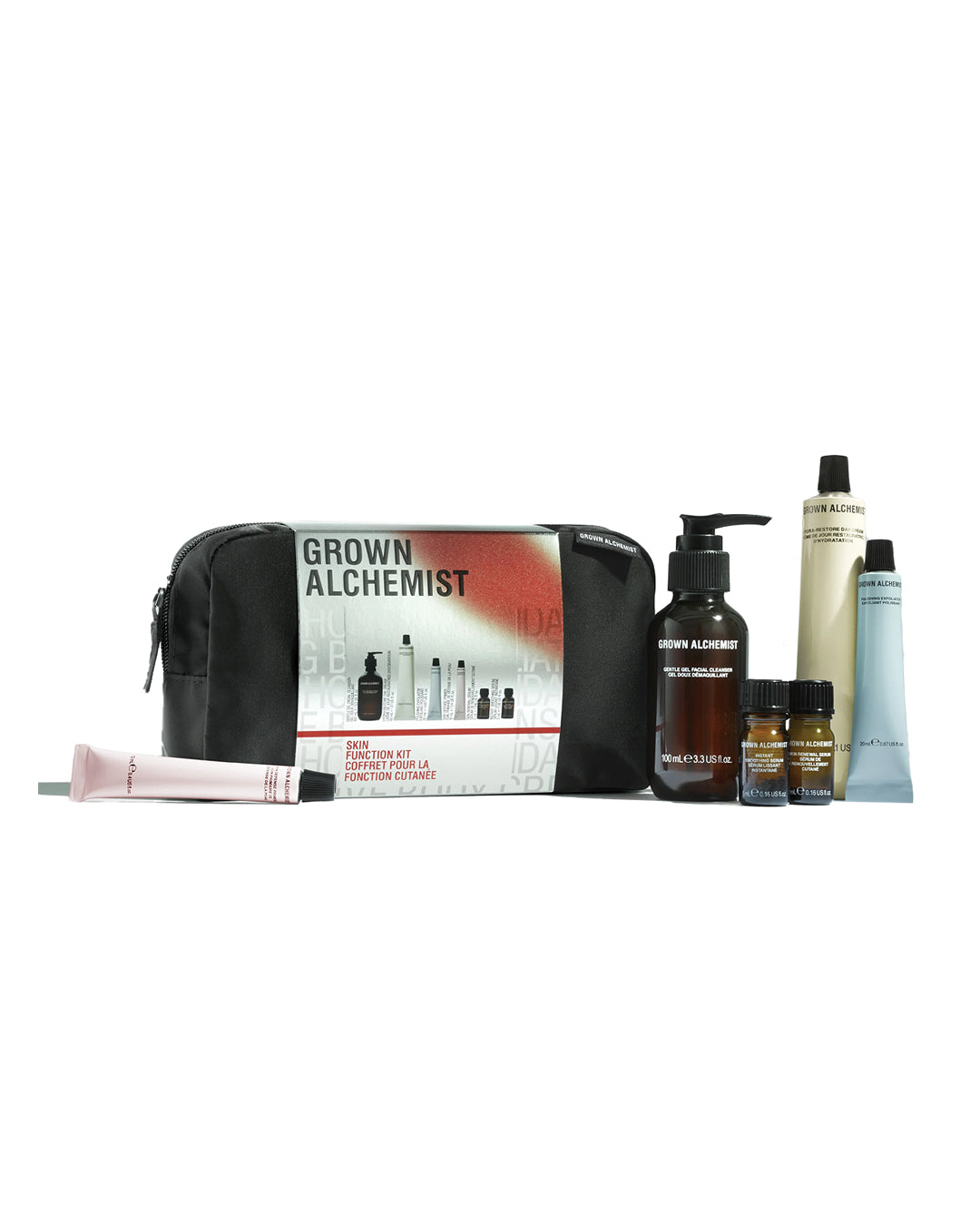 Grown Alchemist hair care product set with black pouch on a white background