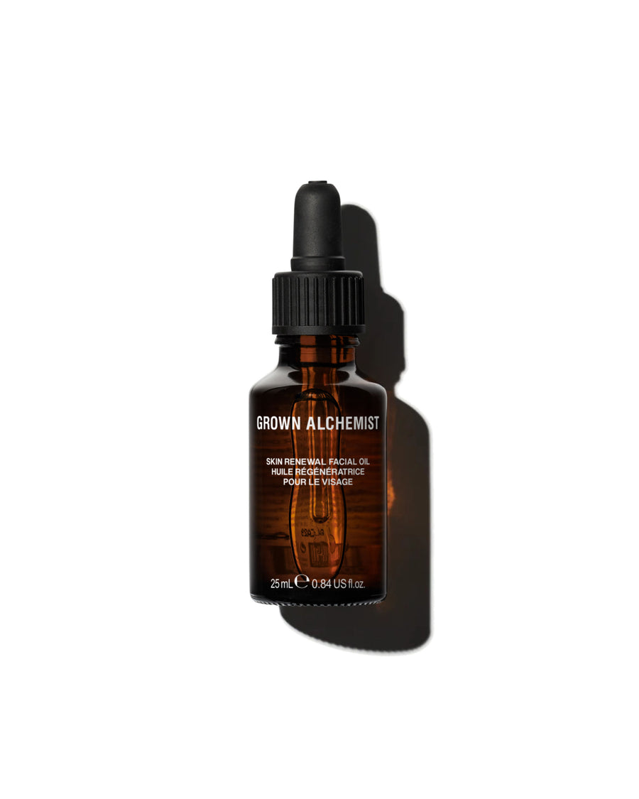 Brown glass bottle with dropper labeled 'Grown Alchemist' on a white background
