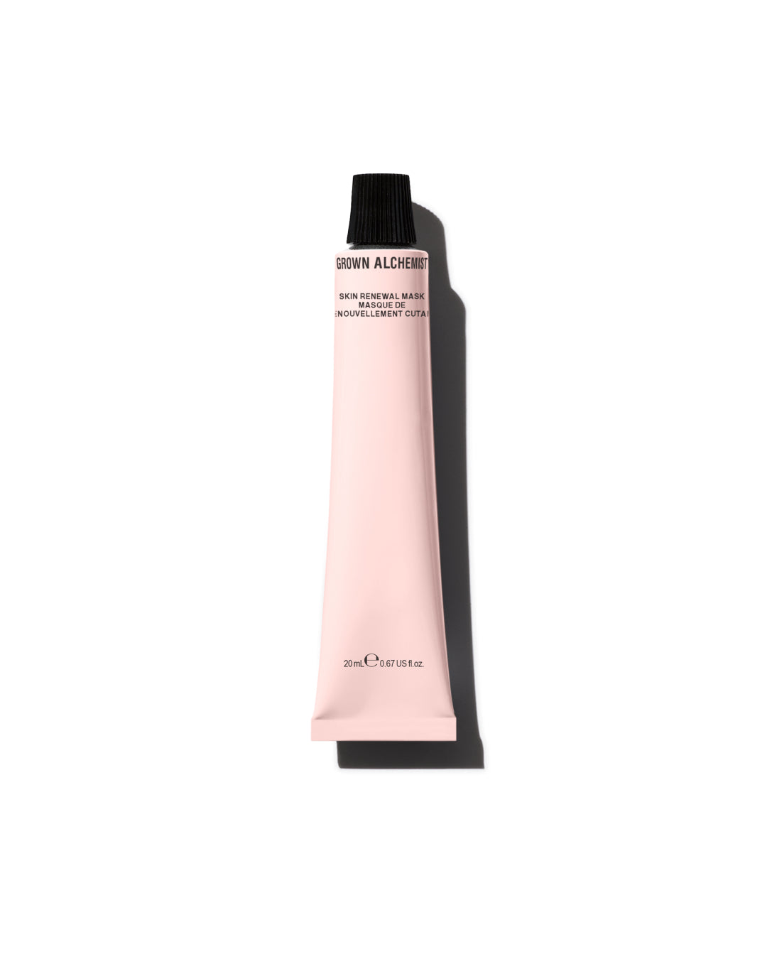 Pink tube of cosmetic product with black cap on a white background