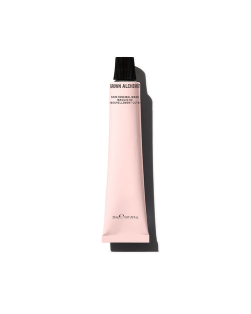 Pink tube of cosmetic product with black cap on a white background