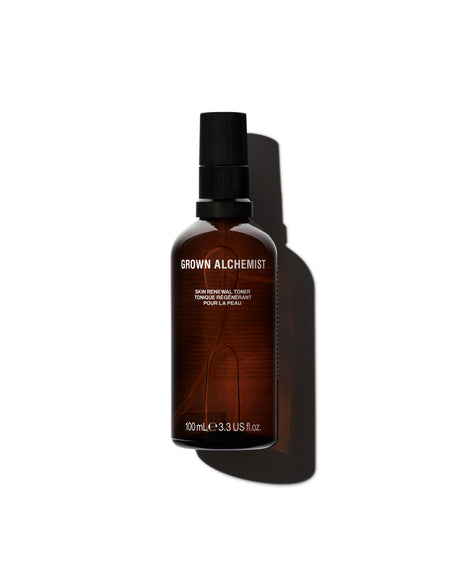 Brown bottle with black cap on a white background, featuring 'Grown Alchemist' branding.