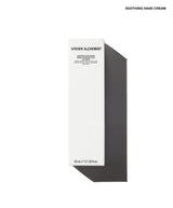 A tall, narrow white product box for Grown Alchemist Soothing Hand Cream, shown on a clean white background with a dark gray shadow. The box features black text and is positioned vertically with a diagonal shadow extending to the right.
