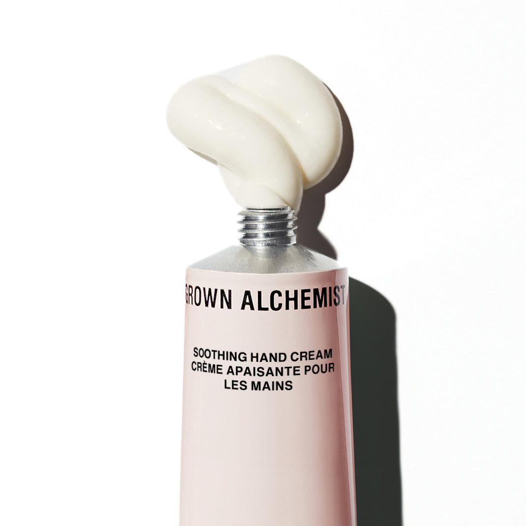 Grown Alchemist soothing hand cream with a visible swatch on a white background