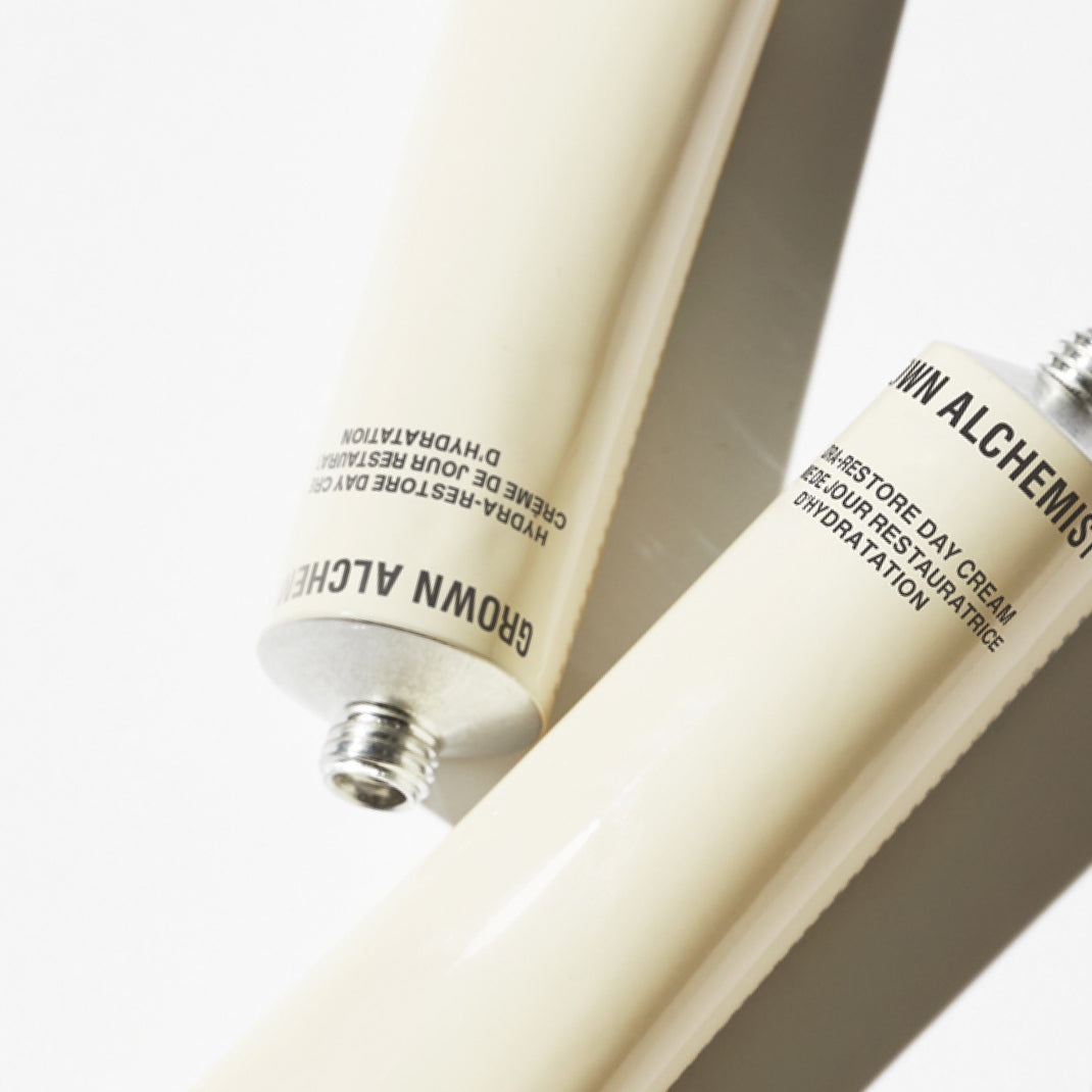 Two tubes of Grown Alchemist cream on a white background