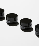 Jars of Regenerating night cream on white background.